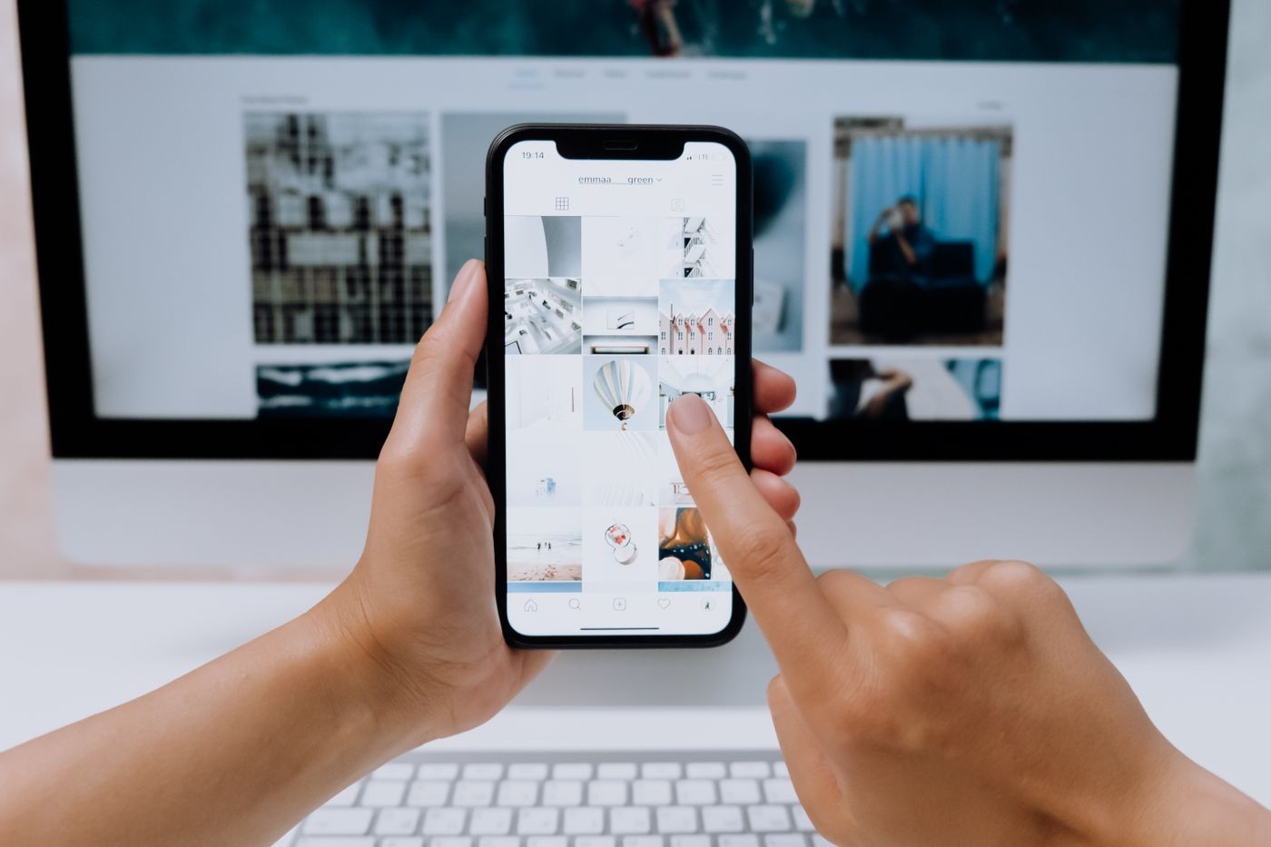 Social media planning on phone and laptop